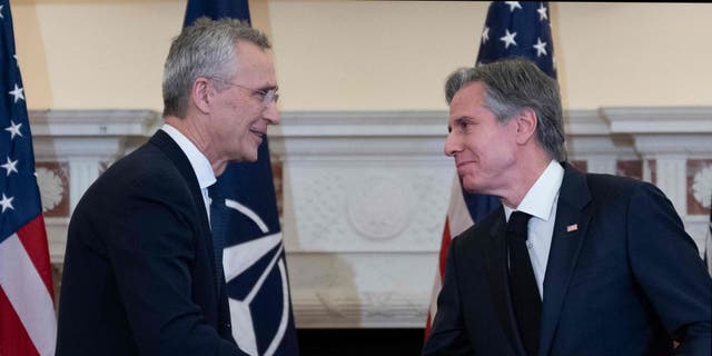 NATO Secretary General Jens Stoltenberg and US Secretary of State Antony Blinken shake hands after a press conference in the Benjamin Franklin Room of the State Department in Washington, D.C., on Feb. 8, 2023.