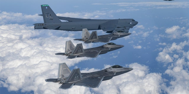 A U.S. B-52 bomber and C-17 and South Korean F-35 fighter jets fly over the Korean Peninsula during a joint air drill, Dec. 20, 2022.