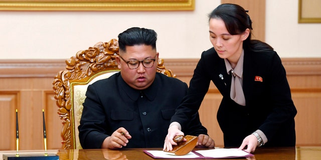 In this Sept. 19, 2018, file photo, Kim Yo Jong, right, sister of North Korean leader Kim Jong Un, helps Kim sign joint statement following the summit with South Korean President Moon Jae-in at the Paekhwawon State Guesthouse in Pyongyang.