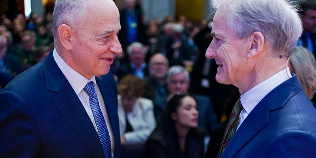 NATO's Deputy Secretary General Mircea Geoana, left, and Norway's Prime Minister Jonas Gahr Store speak at a conference in Oslo, Norway, on Feb. 6, 2023. 