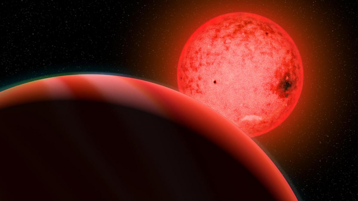 A glowing red star is seen in the background, and a reddish striped planet stands in the foreground, partially off-screen.