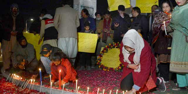 A candlelight vigil for the victims of Monday's suicide bombing is held in Quetta, Pakistan, on Feb. 2, 2023. A suicide bomber killed 101 people at a mosque in northwest Pakistan this week. Pakistani troops also killed 2 insurgents at a militant hideout near the Afghanistan border.