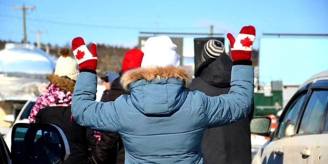 A Canadian worshiper lifts her hands at Higher Life Church in Saint John, New Brunswick.