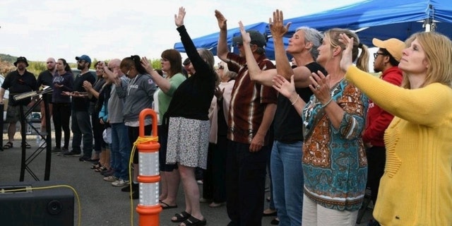 Worshipers gather at Higher Life Church in Saint John, New Brunswick, whose pastors were arrested for keeping the doors open during the pandemic.