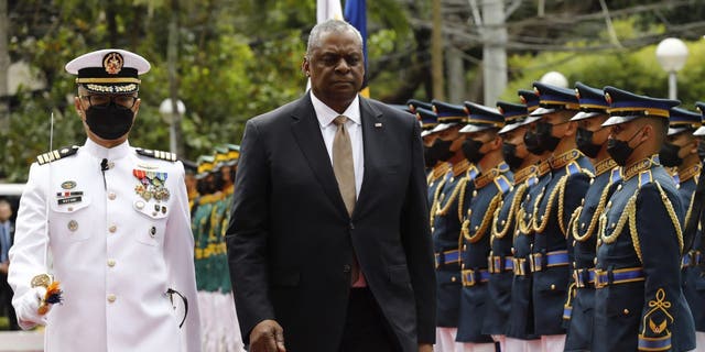 Defense Secretary Lloyd Austin walks past military guards during his arrival at the Department of National Defense in Camp Aguinaldo in Quezon City, Metro Manila, Philippines, on Thursday, Feb. 2, 2023.