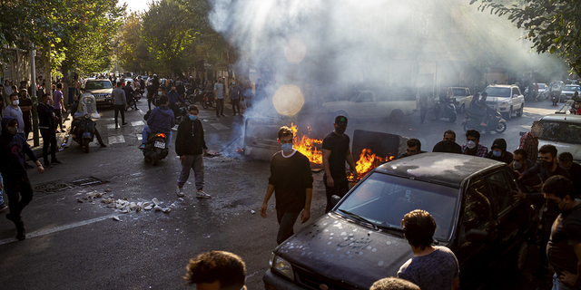 Iranians protest the death of 22-year-old Mahsa Amini after she was detained by the morality police in Tehran, Oct. 27, 2022.