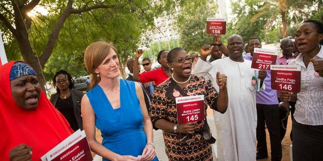 U.S. Ambassador to the United Nations Samantha Power stands between Aisha Yesufu, left, and Bring Back Our Girls co-founder Obiageli Ezekwesili during a vigil in Abuja, Nigeria, April 21, 2016.