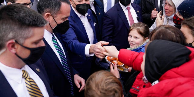 President Biden meets with Ukrainian refugees and humanitarian aid workers during a visit to PGE Narodowy Stadium, Saturday, March 26, 2022, in Warsaw, Poland.