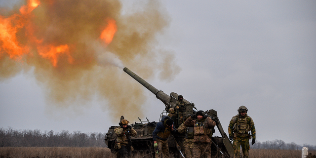 Ukrainian artillery teams fire toward Russian troop positions in Bakhmut, Ukraine.