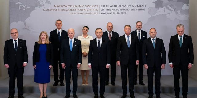 Leaders of the Bucharest Nine countries Feb. 22, 2023, in Warsaw.  From left to right are Latvian President Egils Levits, Slovakia President Suzana Caputova, NATO Secretary General Jens Stoltenberg, Biden, Hungarian President Katalin Novák, Polish President Andrzej Duda, Estonia President Alar Karis, Romania President Klaus Werner Iohannis, Czech Republic Prime Minister Petr Fiala, Bulgaria President Ruman Radev and Lithuania President Gitanas Nauseda. 