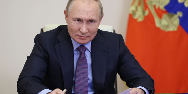President Vladimir Putin speaks during a videoconference outside Moscow on Jan. 30.