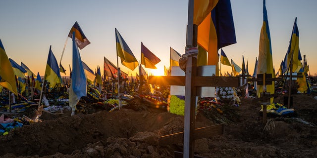 Ukrainian flags are planted in the graves of soldiers at a Kharkiv cemetery on Jan. 24, 2023 in Kharkiv, Ukraine. 