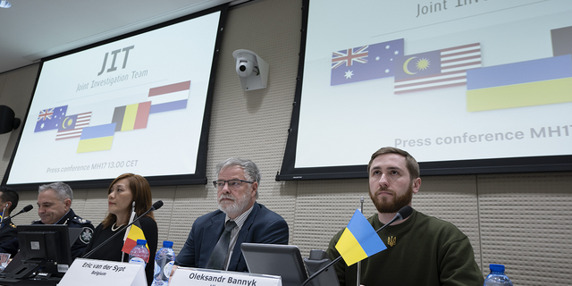 Oleksandr Bannyk, Ukraine, right, Eric van der Sypt, Belgium, second right, Asha Hoe Soo Lian, Malaysia, second left, and David McLean, Australia, are seen during the Joint Investigation Team (JIT) news conference in The Hague, Netherlands, on Wednesday, Feb. 8, 2023.