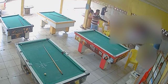 Surveillance video captured a shooting rampage at a Brazilian pool hall with some patrons seen scrambling for their lives.