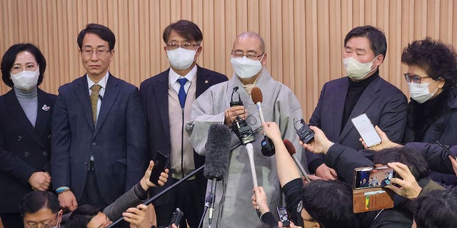 A South Korean court ruled that a 14th-century Korean Buddhist statue should be sent back to a Japanese temple where it was stolen in 2012. South Korean Buddhist monk Woonou speaks to the media outside the court in Daejeon, South Korea, on Feb. 1, 2023. 