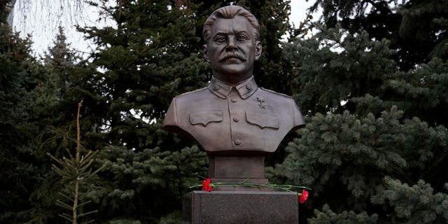 A picture shows the newly unveiled bronze bust of Soviet leader Joseph Stalin outside the museum dedicated to the Battle of Stalingrad in the southern Russian city of Volgograd on Feb. 1, 2023, on the eve of commemorations of the Soviet victory in the Stalingrad battle.