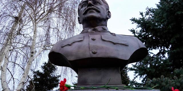 A picture shows the newly unveiled bronze bust of Soviet leader Joseph Stalin outside the museum dedicated to the Battle of Stalingrad in the southern Russian city of Volgograd on Feb. 1, 2023, on the eve of commemorations of the Soviet victory in the Stalingrad battle.