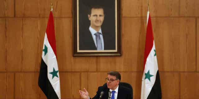 Syrian Ambassador Milad Atieh speaks during a press conference in Damascus, Syria, on Feb. 2, 2023. Atieh dismissed the global chemical weapons watchdog's claim that the air force dropped two cylinders of chlorine gas on the city of Douma in 2018. 