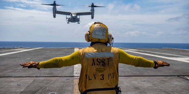 An Osprey prepares to land on the flight deck of the USS Nimitz as it conducts exercises in the South China Sea on Feb. 11.
