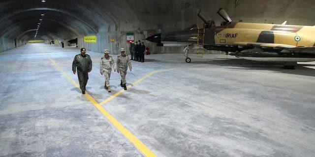 Iran's Army chief, Major General Abdolrahim Mousavi and Iranian Armed Forces Chief of Staff Major General Mohammad Bagheri visit the first underground air force base, called "Eagle 44" at an undisclosed location in Iran, in this handout image obtained on Feb. 7, 2023. 