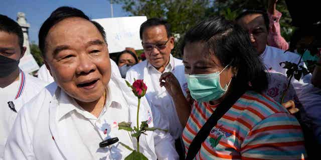 Thailand's Deputy Prime Minister Prawit Wongsuwan greets supporters while campaigning for the upcoming general election in Bangkok, Thailand, on Feb. 14, 2023.