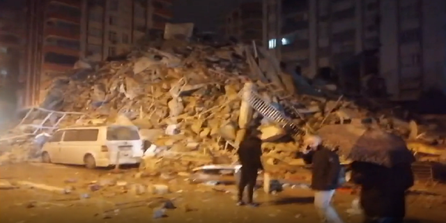 Footage taken in the Turkish city of Adana shows rubble from a high-rise building that collapsed after a 7.8-magnitude earthquake hit the region. 