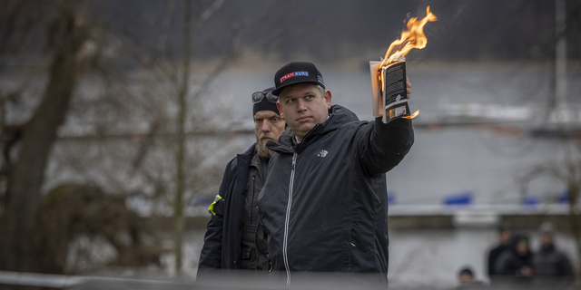 Rasmus Paludan burns the Koran outside the Turkish embassy on Jan. 21, 2023, in Stockholm, Sweden.