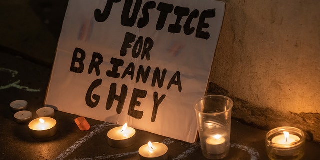 A sign and candles are pictured at a vigil for transgender teenager Brianna Ghey held outside the Department for Education by thousands of transgender people and supporters on 15 February 2023 in London, United Kingdom.