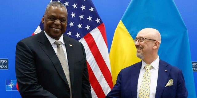 US Secretary of Defense Lloyd J. Austin III, right, shakes hand with Ukrainian Minister of Defense Oleksii Reznikov during a bilateral meeting ahead of a Meeting of the NATO Council Defense Ministers at the Alliance headquarters in Brussels, Wednesday, Oct. 12, 2022. 