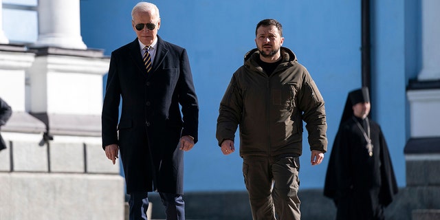 US President Joe Biden (L) walks with Ukrainian President Volodymyr Zelenskyy (R) at St. Michael's Golden-Domed Cathedral during an unannounced visit, in Kyiv on February 20, 2023. 