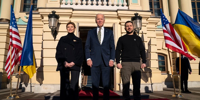 President Joe Biden, center, poses with Ukrainian President Volodymyr Zelenskyy, right, and Olena Zelenska, left, spouse of President Zelenskyy, at Mariinsky Palace during an unannounced visit in Kyiv, Ukraine, Monday, Feb. 20, 2023.