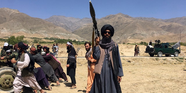 Taliban soldiers stand guard in Panjshir province northeastern of Afghanistan, Wednesday, Sept. 8, 2021. 