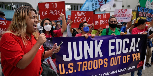 Demonstrators shout slogans as they protest against the visit of U.S. Defense Secretary Lloyd Austin outside Camp Aguinaldo military headquarters in metro Manila, Philippines on Thursday, Feb. 2, 2023. 