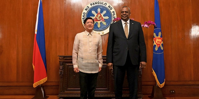 U.S. Secretary of Defense Lloyd James Austin III, right, poses with Philippine President Ferdinand Marcos Jr during a courtesy call at the Malacanang Palace in Manila, Philippines on Thursday, Feb. 2, 2023. 