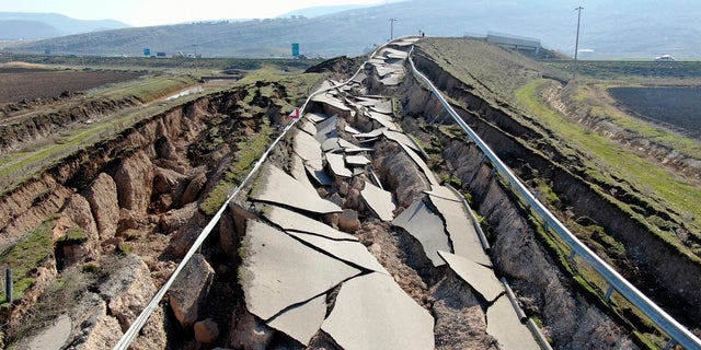 Cracks are seen along the road near the town of Pazarcik in southern Turkey, on Sunday, Feb. 12, following last week's earthquake.