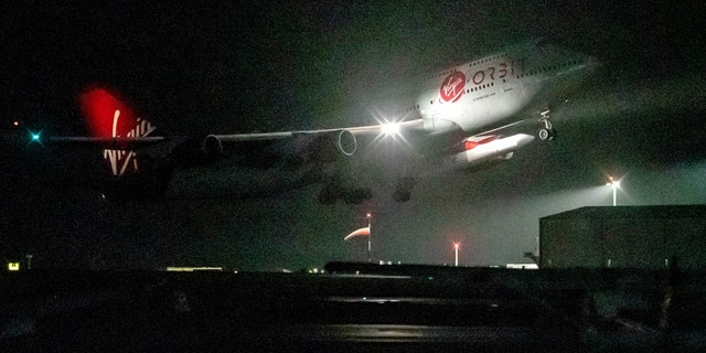 A repurposed Virgin Atlantic Boeing 747 aircraft, named Cosmic Girl, carrying Virgin Orbit's LauncherOne rocket, takes off from Spaceport Cornwall at Cornwall Airport, Newquay, on Jan. 9, 2023. 