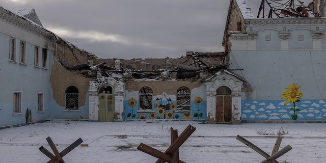 Paintings are seen on a wall of a heavily damaged during Russian attacks House of Culture, on Feb 7, 2023 in Irpin, Ukraine. 