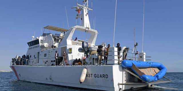 Migrants from sub-Saharan Africa are rescued by the Tunisian Coast Guard off the coast of central Tunisian on Oct. 4, 2022. The Tunisian Coast Guard recovered 54 bodies from a sinking boat of the countries coast on Wednesday night, 14 others were killed in the accident.