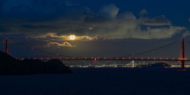 Full Worm Moon rises over the Golden Gate Bridge in San Francisco, as seen from Point Bonita of Sausalito, California, United States on March 7, 2023. 