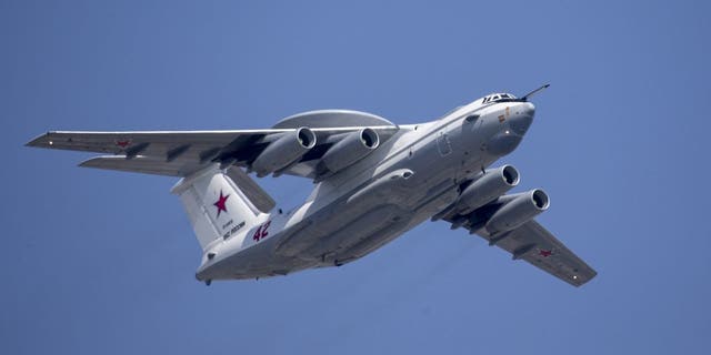 In this file photo from May 7, 2019, a Russian Beriev A-50 airborne early warning and control training aircraft flies over Red Square during a rehearsal for the Victory Day military parade in Moscow. 