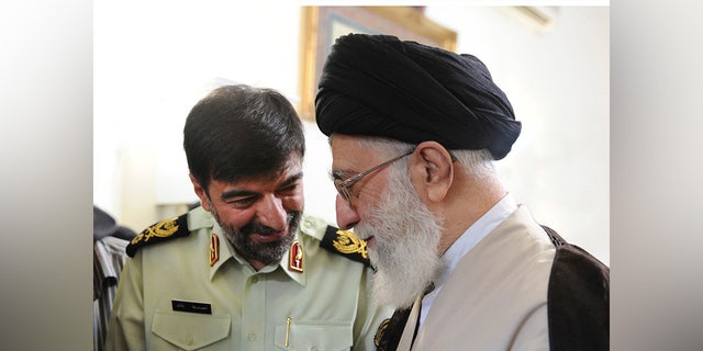 In this undated photo released on Saturday, Jan. 7, 2023, by the official website of the office of the Iranian supreme leader, Supreme Leader Ayatollah Ali Khamenei, right, speaks with Gen. Ahmad Reza Radan, Iran.