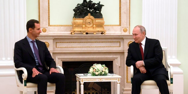 Russian President Vladimir Putin and Syrian President Bashar Assad meet at the Kremlin in Moscow, Wednesday, March 15, 2023.