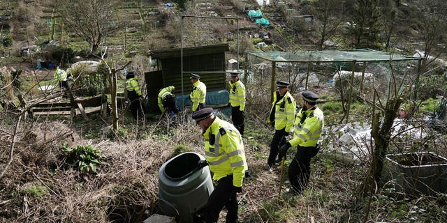 Police officers work in an urgent search operation to find the missing baby of Constance Marten, who has not had any medical attention since birth in early January, in Roedale Valley Allotments, in Brighton, on Feb. 28, 2023. 