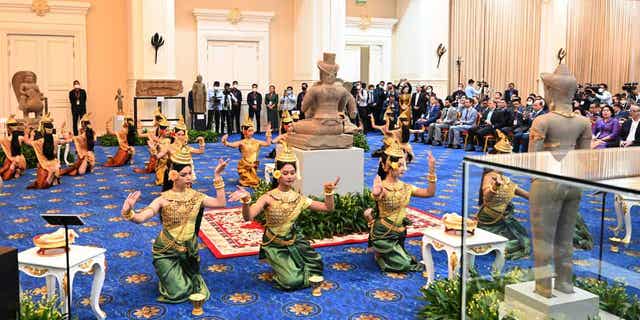 Dancers perform during a ceremony at Peace Palace, in Phnom Penh, Cambodia, on March 17, 2023. Artifacts that had been illegally smuggled out from Cambodia were welcomed home on Friday at a celebration led by Prime Minister Hun Sen.