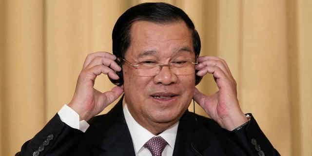 Cambodia's Prime Minister Hun Sen attends a joint press conference with French President Emmanuel Macron in Paris, on Dec. 13, 2022. Cambodia’s prime minister has hinted that he intends to step down as the country’s leader when the new government is installed.