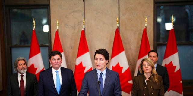 Canada's Prime Minister Justin Trudeau, center, speaks during a news conference on Parliament Hill in Ottawa, Ontario, on Monday, March 6, 2023. 