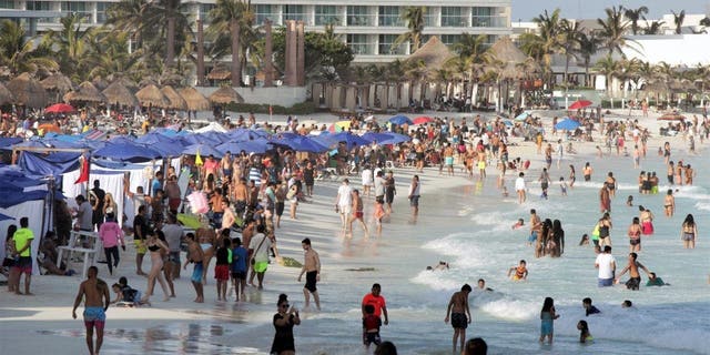 Bathers enjoy Forum Beach as tourism returns to the city during Holy Week on April 3, 2021, in Cancun, Mexico.