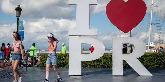 Tourists walk through the docking area of San Juan, Puerto Rico, on Aug. 3, 2021. 