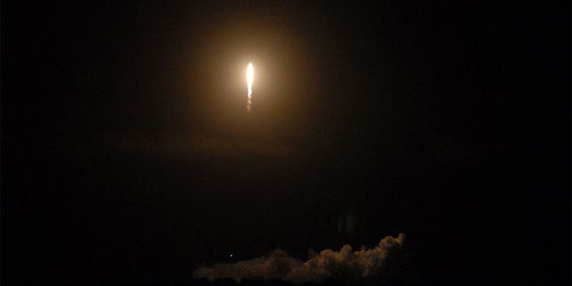 A SpaceX rocket launching into orbit at Cape Canaveral Space Force Station in Cape Canaveral, Florida.