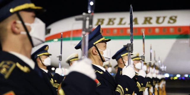 Chinese honor guards stand at attention during a welcome ceremony for Belarus President Alexander Lukashenko at the airport in Beijing on Feb. 28, 2023.